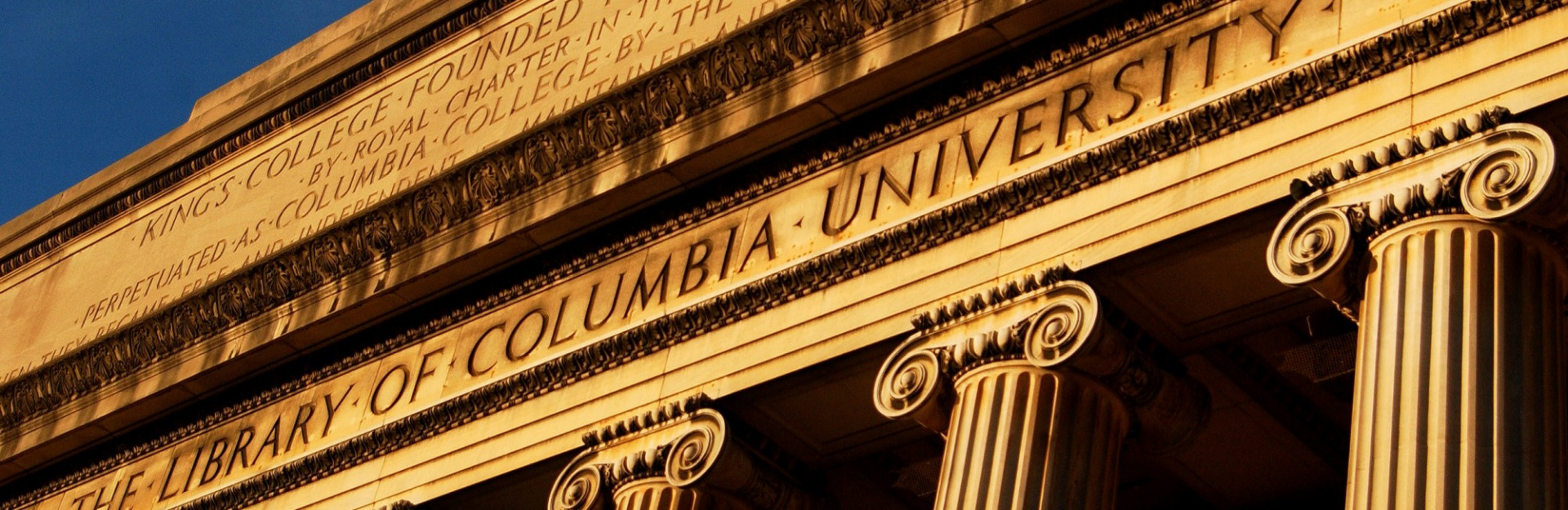 A close up of the entablature of Low Library.