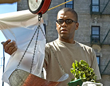 A man weighs a vegetable